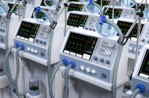 A ROW OF MEDICAL DEVICES IN A WAREHOUSE