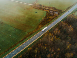 Aerial view of a truck on a highway. 