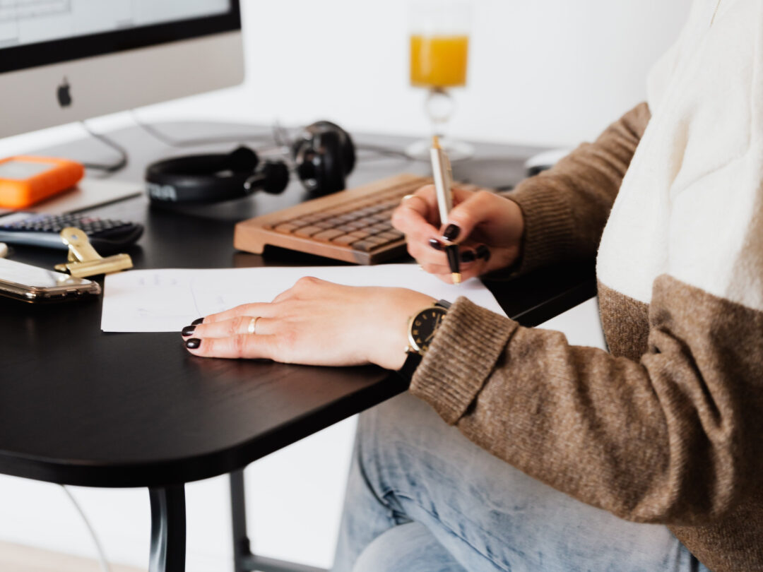 Photo of someone signing a Contract at a desk