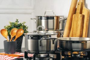 PHOTO OF COOKWARE ON A COUNTER WITH WOODEN SPOONS ISTOCK