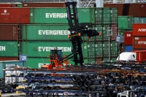 PHOTO OF EVERGREEN SHIPPING CONTAINERS SITTING ON A PORT DOCK BLOOMBERG.jpg