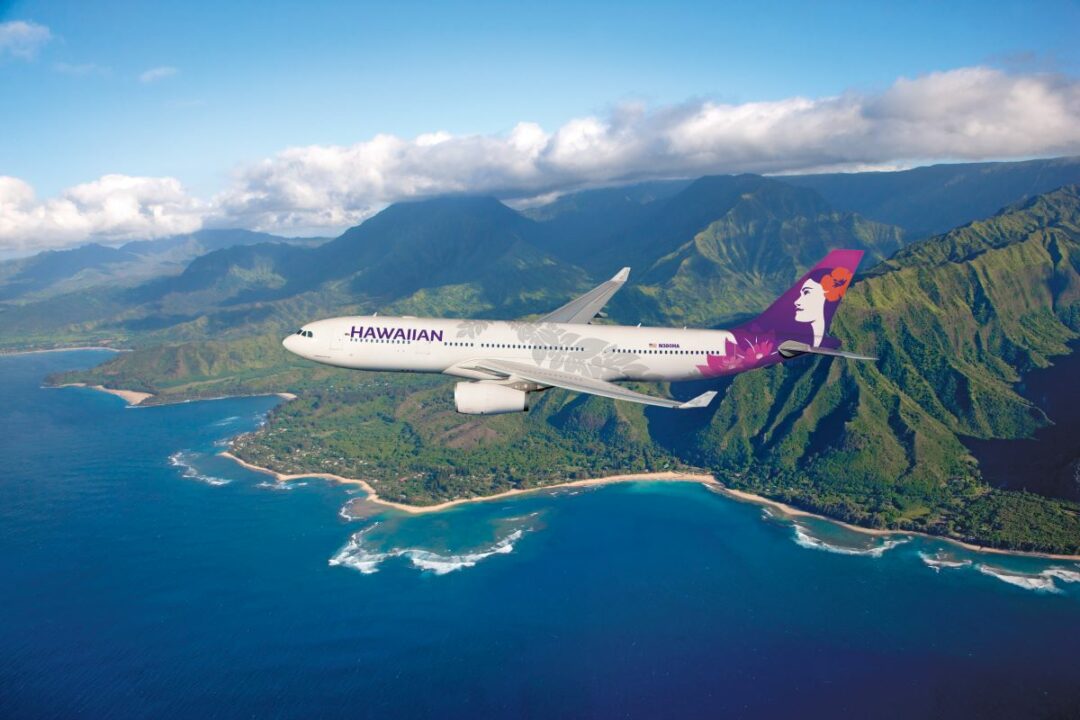 A HAWAIIAN AIRLINES A330 PLANE FLIES OVER TunnelsBeach