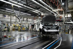 WORKERS BUILD CARS INSIDE A TOYOTA FACTORY 