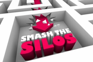 A GRAPHIC OF A RED MAZE, WITH THE WORDS SMASH THE SILOS IN THE MIDDLE