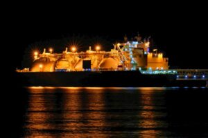 AN LNG TANKER DOCKS AT NIGHT