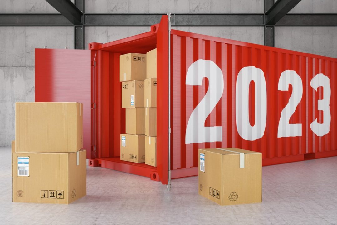 A RED SHIPPING CONTAINER LABELED 2023 STANDS OPEN