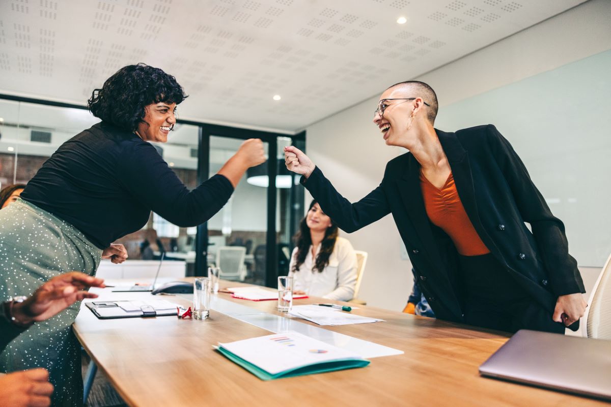 Trust business partnershp women fist bump istock jacoblund 1348871728