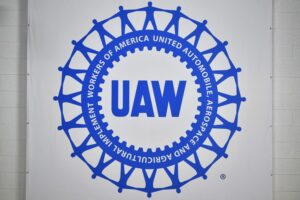 THE BRIGHT BLUE AND WHITE UAW LOGO 