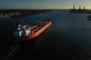 AN OIL TANKER ENTERS A NARROW STRETCH OF SEA