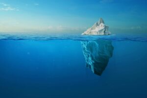 AN ICEBERG FLOATS IN CRYSTAL ARCTIC WATERS, THE MAJORITY OF IT SUBMERGEDStock-Ales_Utovko-1357335597.jpg