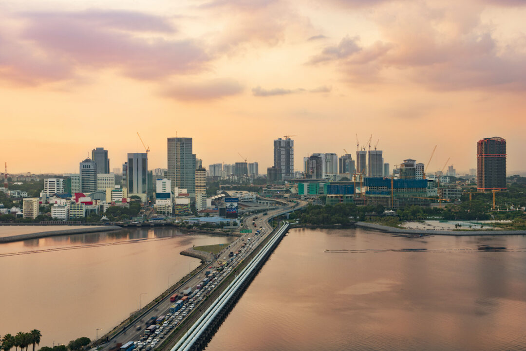 SUNSET OVER A CITY PORT