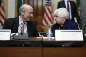 JANET YELLEN SPEAKS WITH GARY GENSLER DURING A MEETING