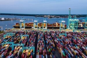 AN AERIAL SHOT OF A LARGE CONTAINER PORT BY TWILIGHT