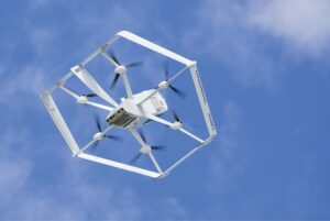 A DRONE SPORTING A HEXAGONAL FRAME HANGS IN THE AIR