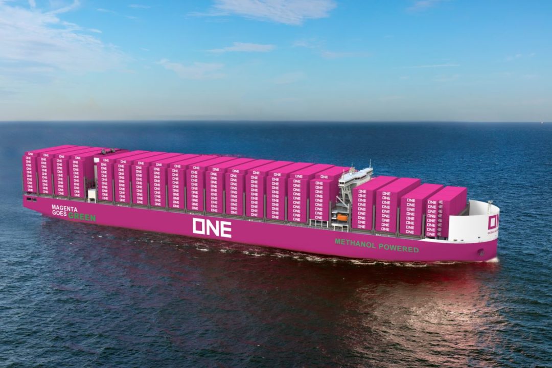 A MAGENTA PINK CONTAINER VESSEL ON THE OCEAN BEARS THE LETTERS ONE ON ITS SIDE