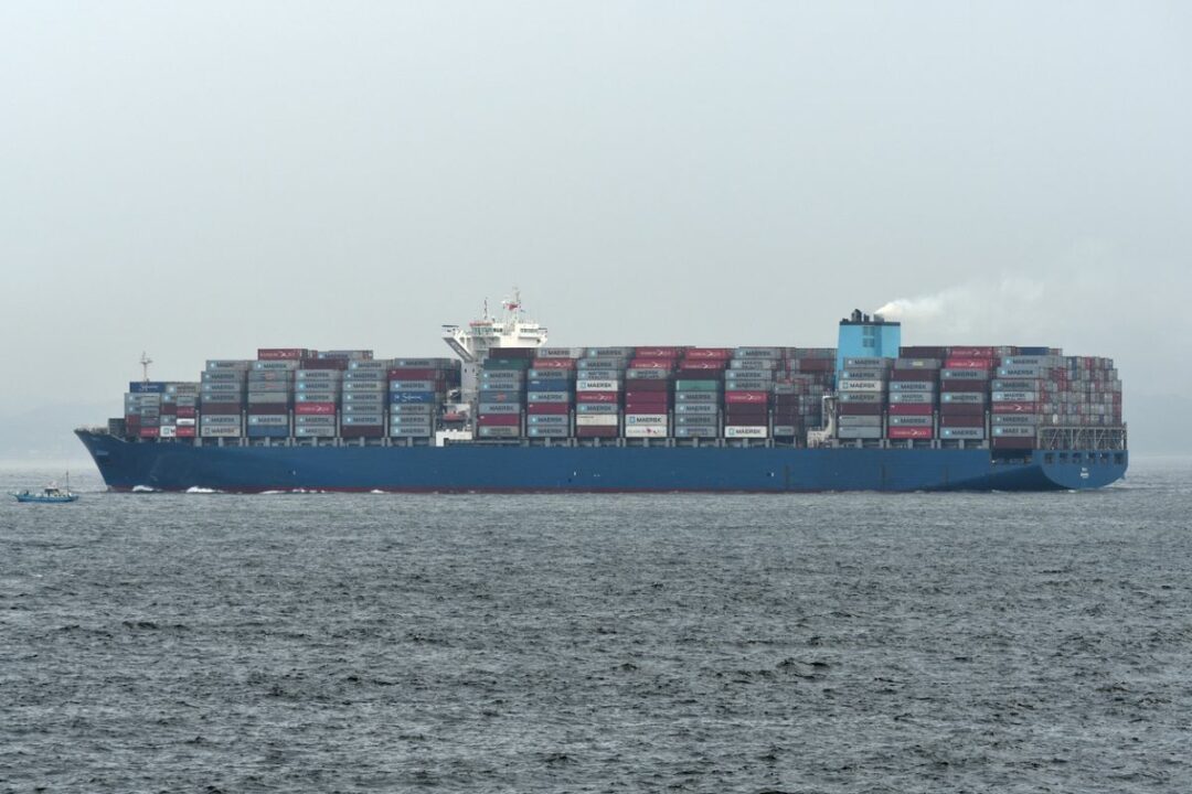 A LADEN CONTAINER VESSEL PLIES THE SEAS.