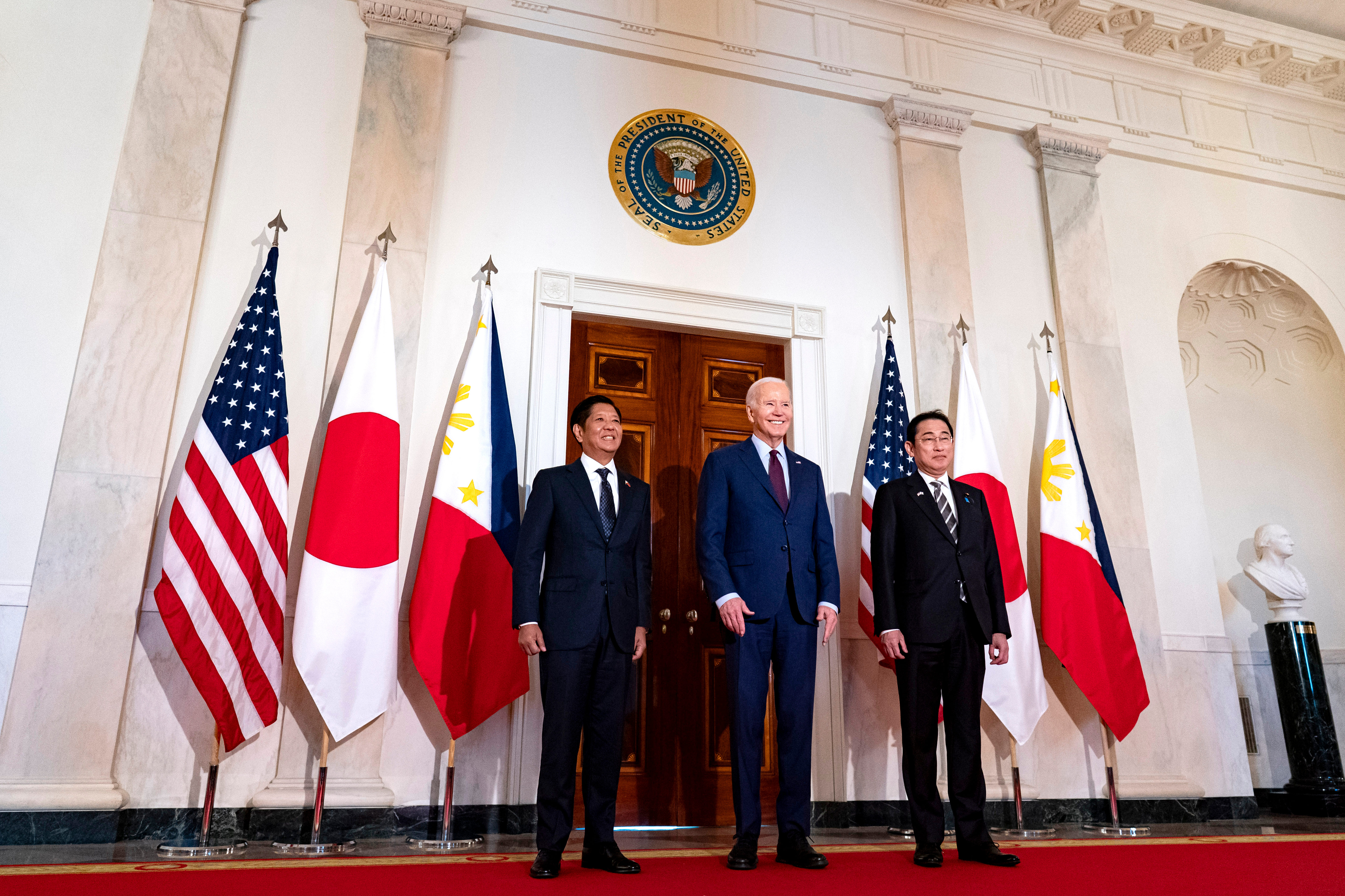 Ferdinand Marcos Jr., left, Joe Biden and Fumio Kishida at the White House.