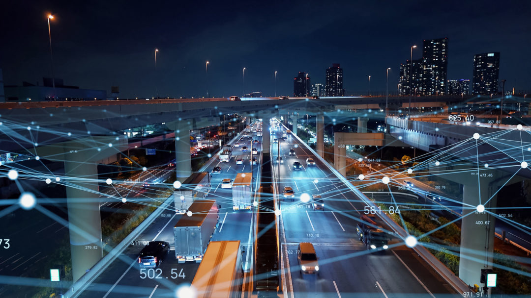 A road full of trucks and cars with a web of lines overlaid