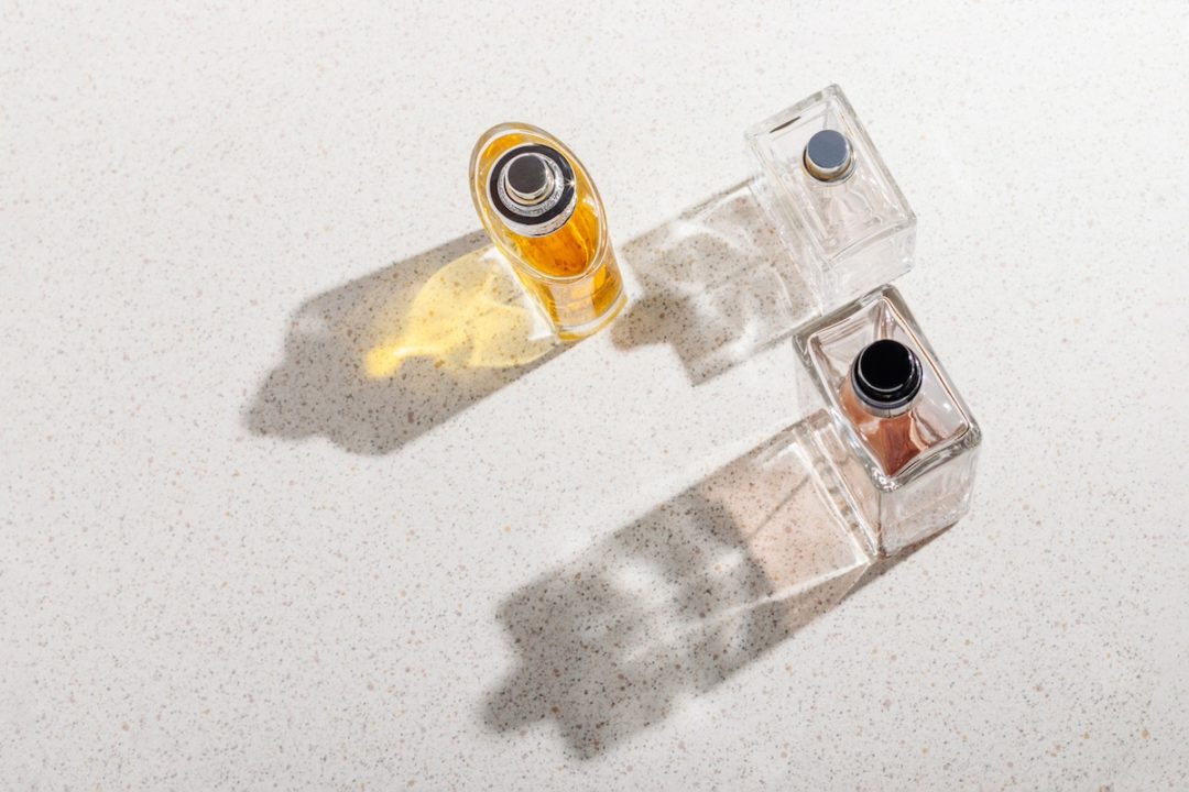 An overhead view of three perfume bottles