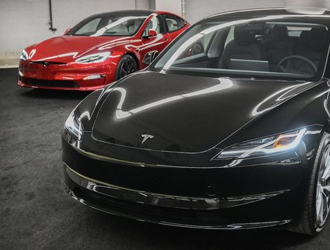 Two Tesla Model 3s on a showroom floor