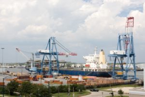 Cranes unloading a ship at a port