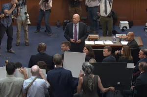 Boeing CEO Dave Calhoun speaking in front of a Senate investigations panel