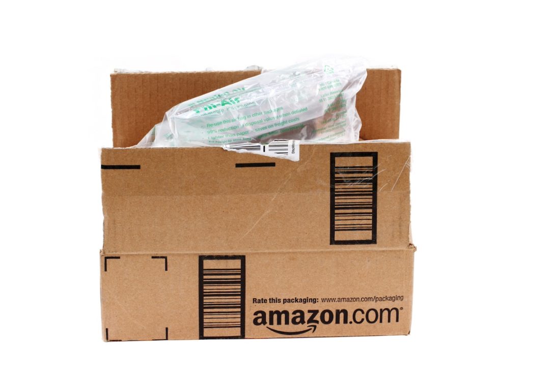 An open Amazon package with plastic air pillows inside