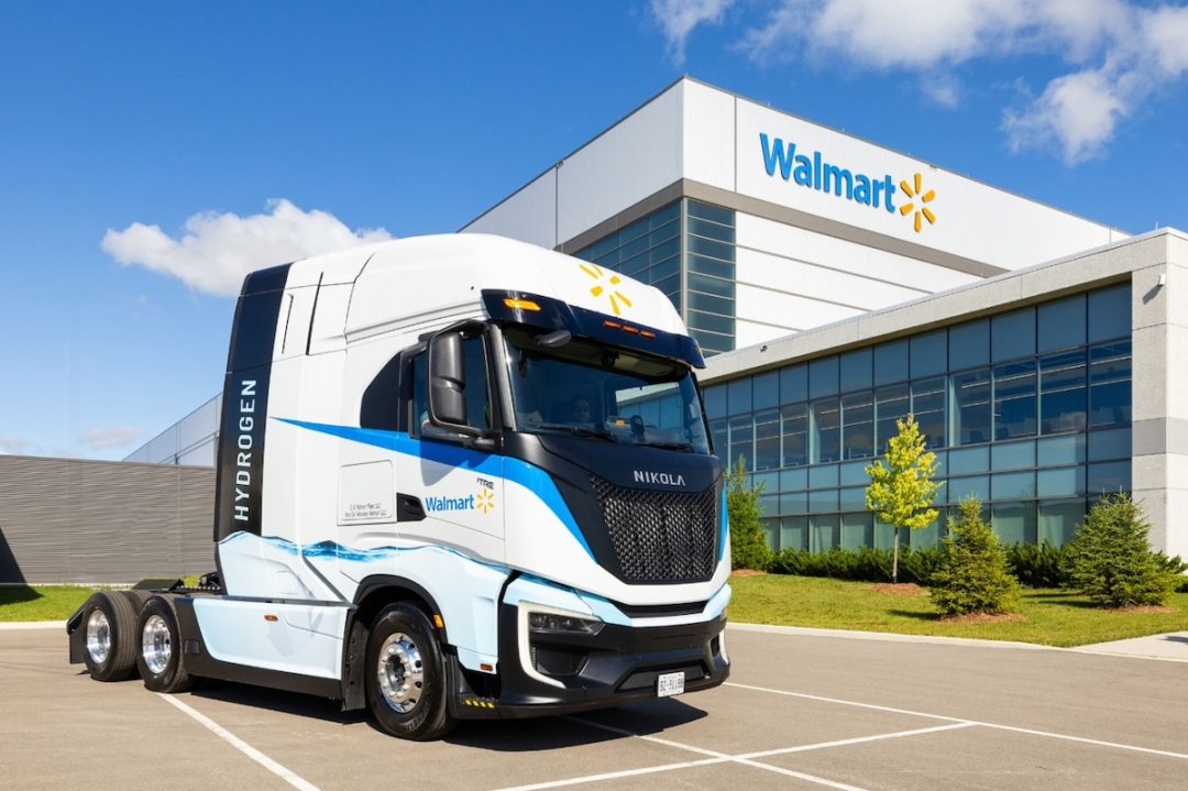 The cab of a hydrogen-powered semi-truck with a Walmart logo on the door