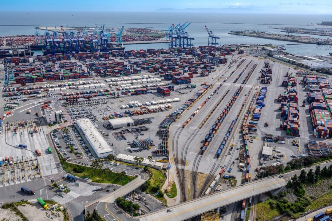 AN AERIAL VEIW OF A LARGE CONTAINER TERMINAL PORT AT A PORT.