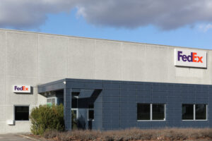 A LARGE BLANK WAREHOUSE BUILDING BEARS THE FEDEX INSIGNIA