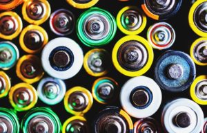 An overhead view of a collection of multicolored lithium-ion batteries