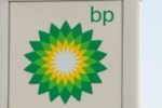 THE BRIGHT GREEN AND YELLOW BP LOGO ADORNS THE SIDE OF A SIGN