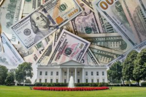 A pile of U.S. dollar bills superimposed over an image of the White House