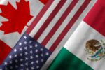 FOLDED PORTIONS OF THE FLAGS OF CANADA, USA AND MEXICO LIE TOGETHER